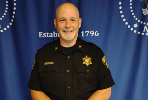 Steuben County Sheriff Jim Allard highlights Undersheriff John McNelis' impactful initiatives, including securing $1.2M in grants and launching the "Emilee’s Challenge" educational trailer.