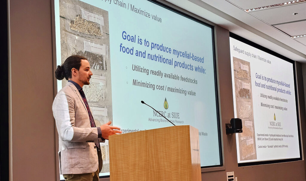 Paul Kuehnert of Shortsville, a dual biotechnology and horticulture major, gives a presentation to researchers, U.S. Department of Defense representatives, and employees of Lockheed Martin on Feb. 6 at Lockheed’s Global Vision Center in Arlington, Va.
